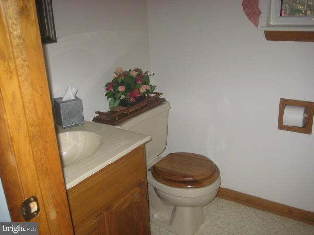 705 Sycamore Leaf Road Severn, MD 21144 - Photo 18 of 18 a bathroom with a sink and a toilet