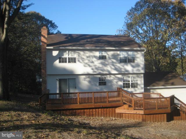 705 Sycamore Leaf Road Severn, MD 21144 - Photo 4 of 18 a view of a house with a yard