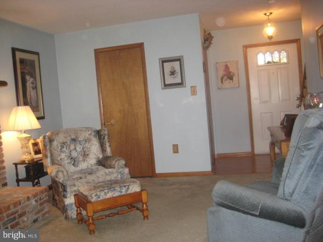 705 Sycamore Leaf Road Severn, MD 21144 - Photo 6 of 18 a living room with furniture and a couch