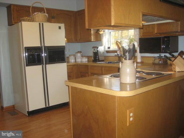 705 Sycamore Leaf Road Severn, MD 21144 - Photo 7 of 18 a kitchen with a counter top space and a sink