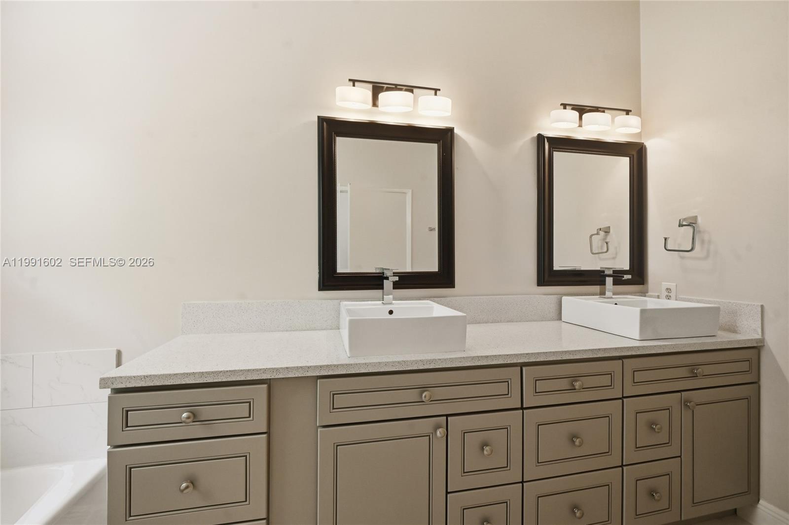 6215 Old Court Road, Unit 505 Boca Raton, FL 33433 - Photo 27 of 36 a bathroom with double vanity sink and a mirror