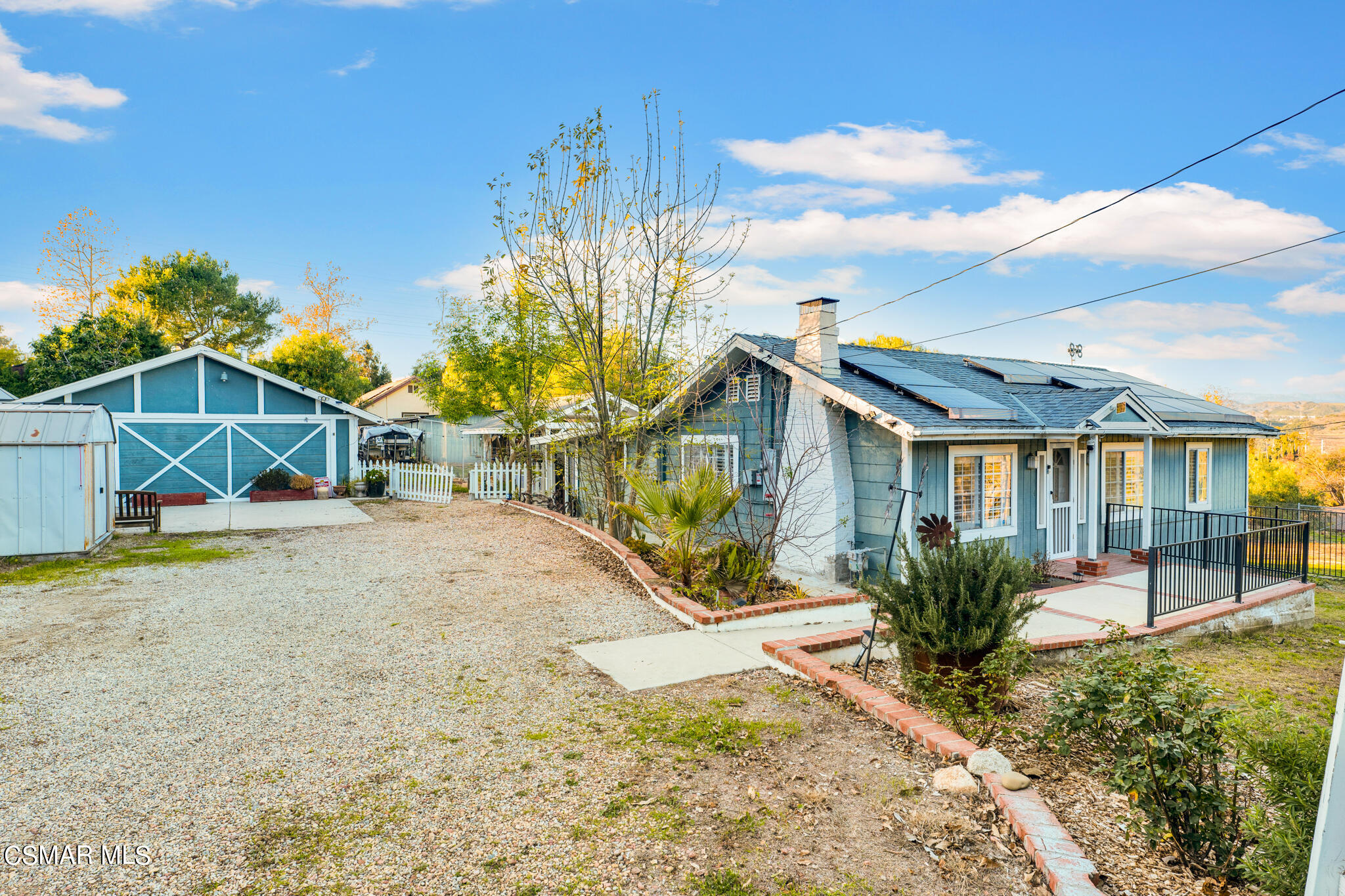 10767 Citrus Drive Moorpark, CA 93021 - Photo 14 of 65 a front view of a house with a yard and potted plants