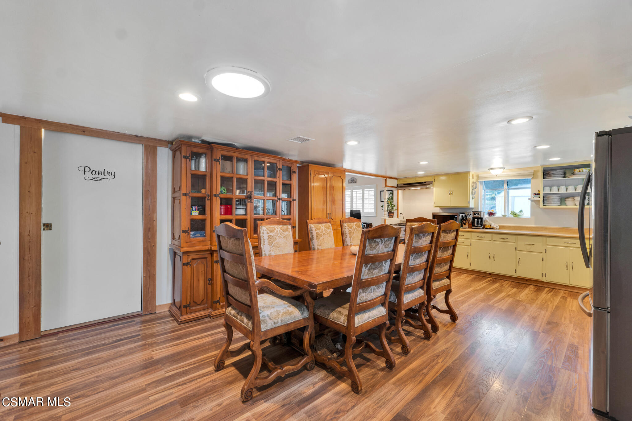 10767 Citrus Drive Moorpark, CA 93021 - Photo 26 of 65 a dining room with furniture and wooden floor