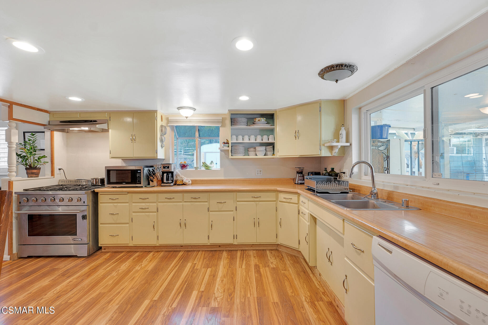 10767 Citrus Drive Moorpark, CA 93021 - Photo 28 of 65 a large kitchen with stainless steel appliances granite countertop a stove and a sink