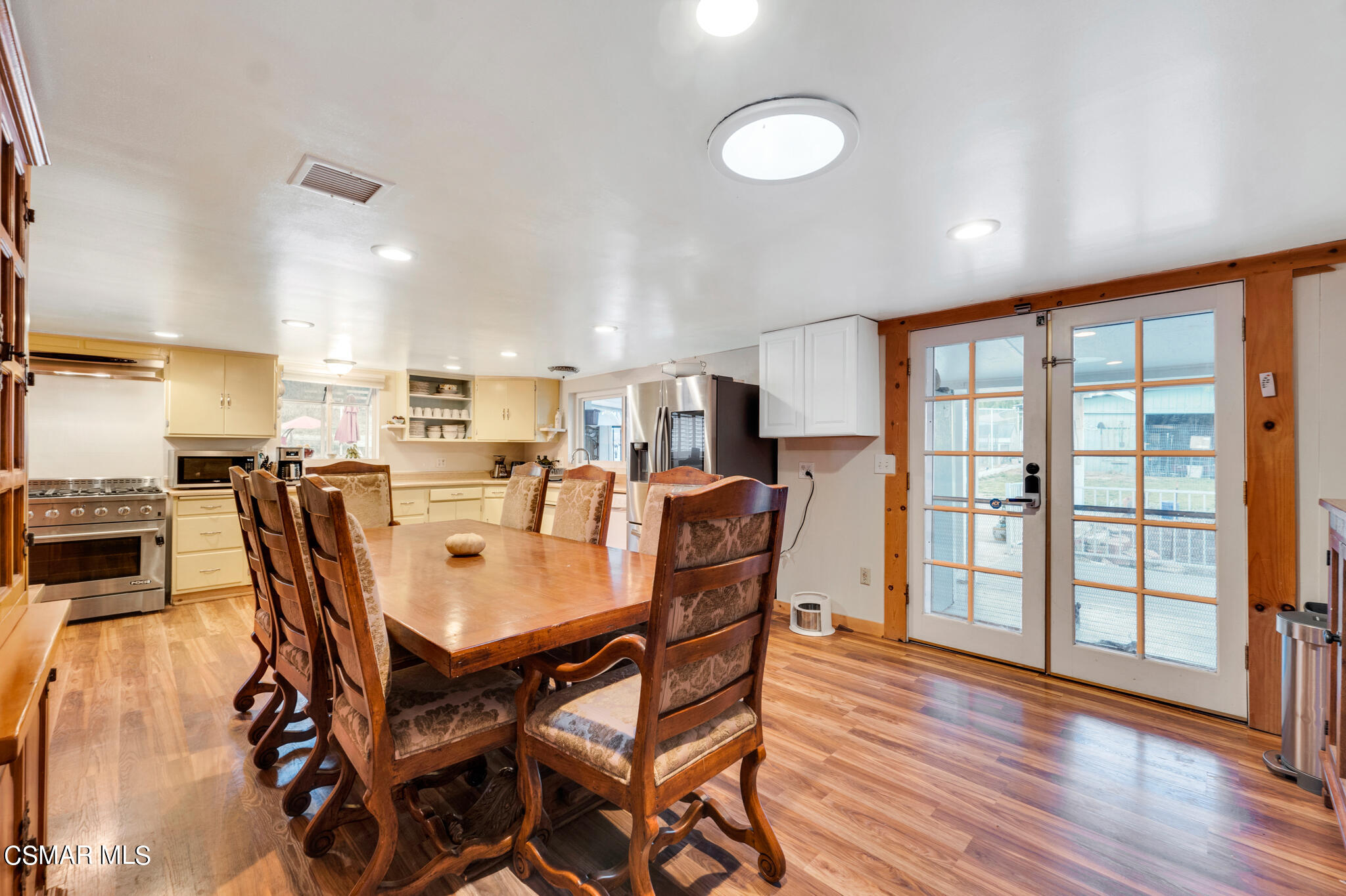 10767 Citrus Drive Moorpark, CA 93021 - Photo 30 of 65 a view of a dining room with furniture and wooden floor
