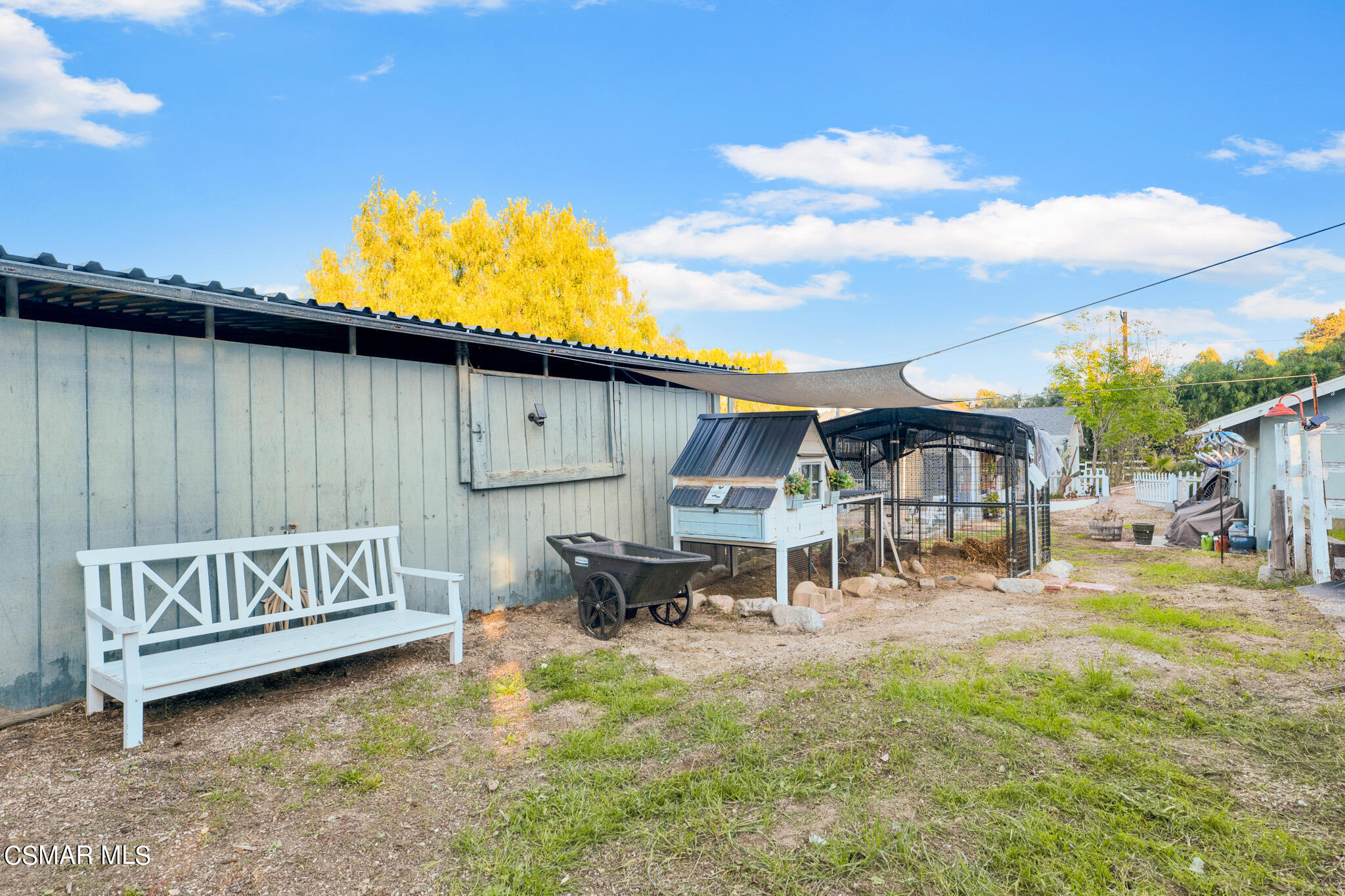 10767 Citrus Drive Moorpark, CA 93021 - Photo 61 of 65 a front view of a house with garden and sitting area