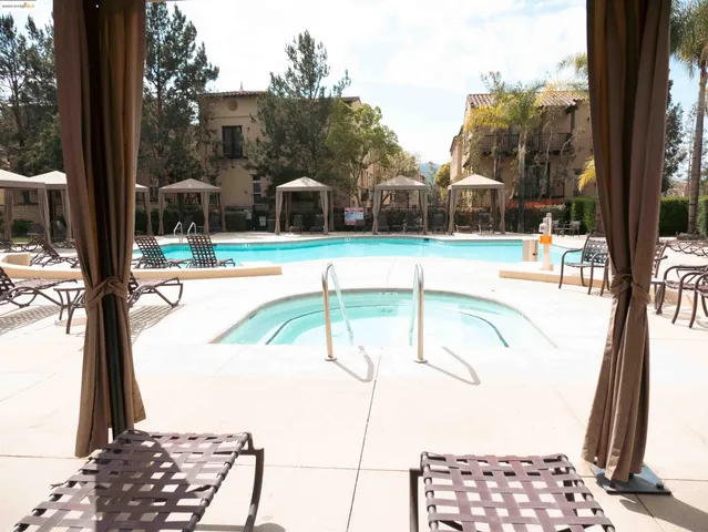 a view of a swimming pool with a patio