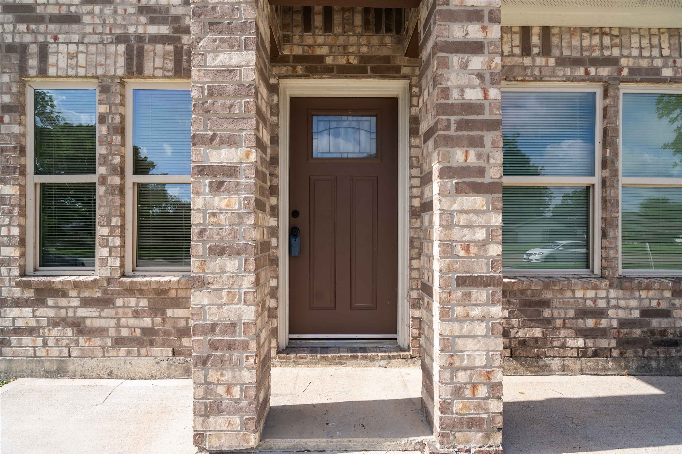 5754 Reed Road, Unit B Houston, TX 77033 - Photo 2 of 29 a front view of a house with a yard