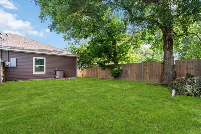 a backyard of a house with lots of green space