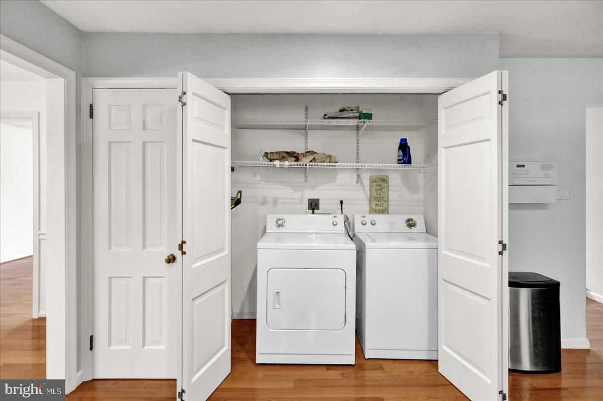 561 Millcross Road Lancaster, PA 17601 - Photo 15 of 52 a view of washer and dryer with wooden floor