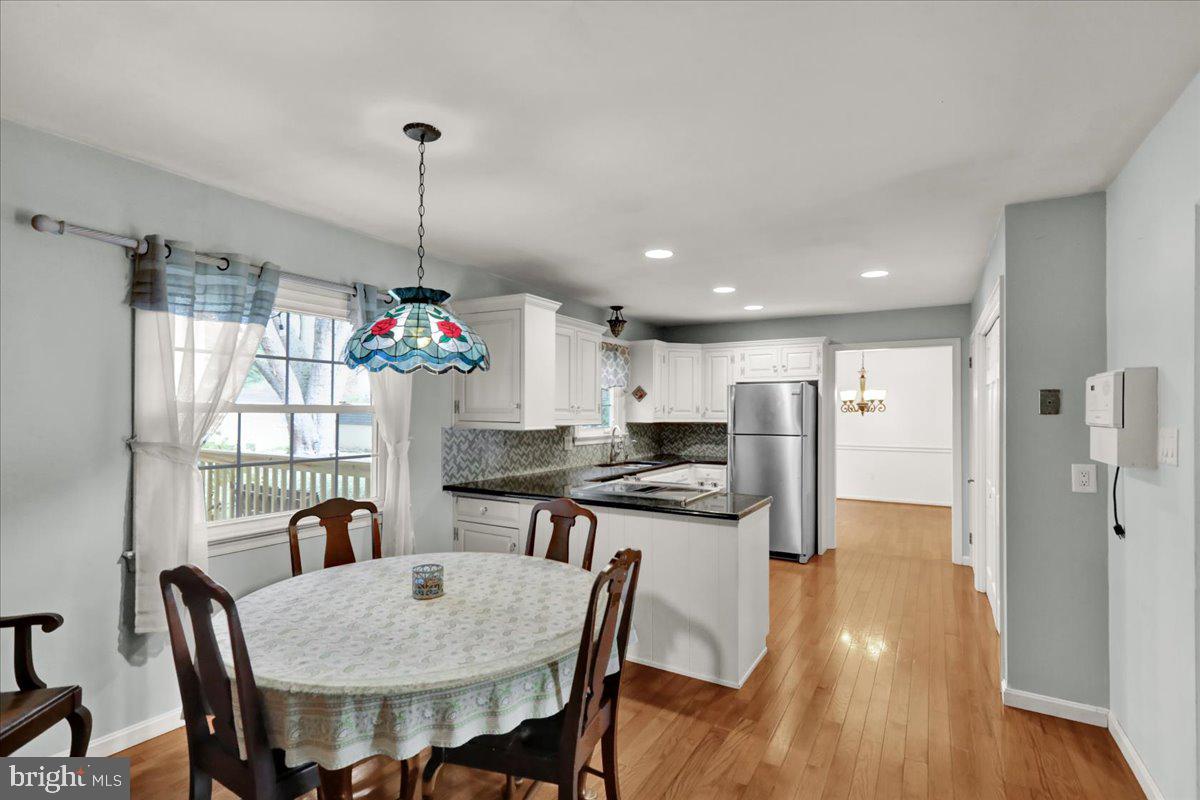 561 Millcross Road Lancaster, PA 17601 - Photo 16 of 52 a view of a dining room with furniture and wooden floor