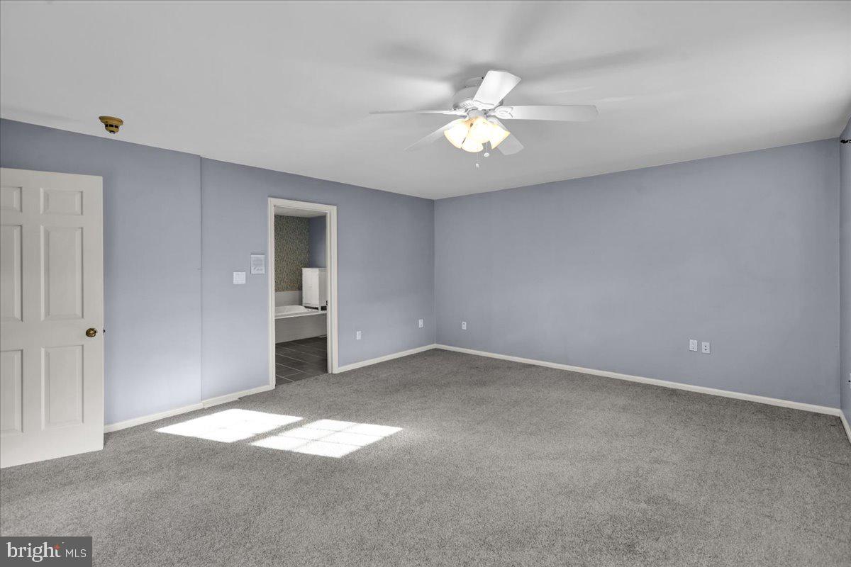 561 Millcross Road Lancaster, PA 17601 - Photo 21 of 52 an empty room with windows and fan