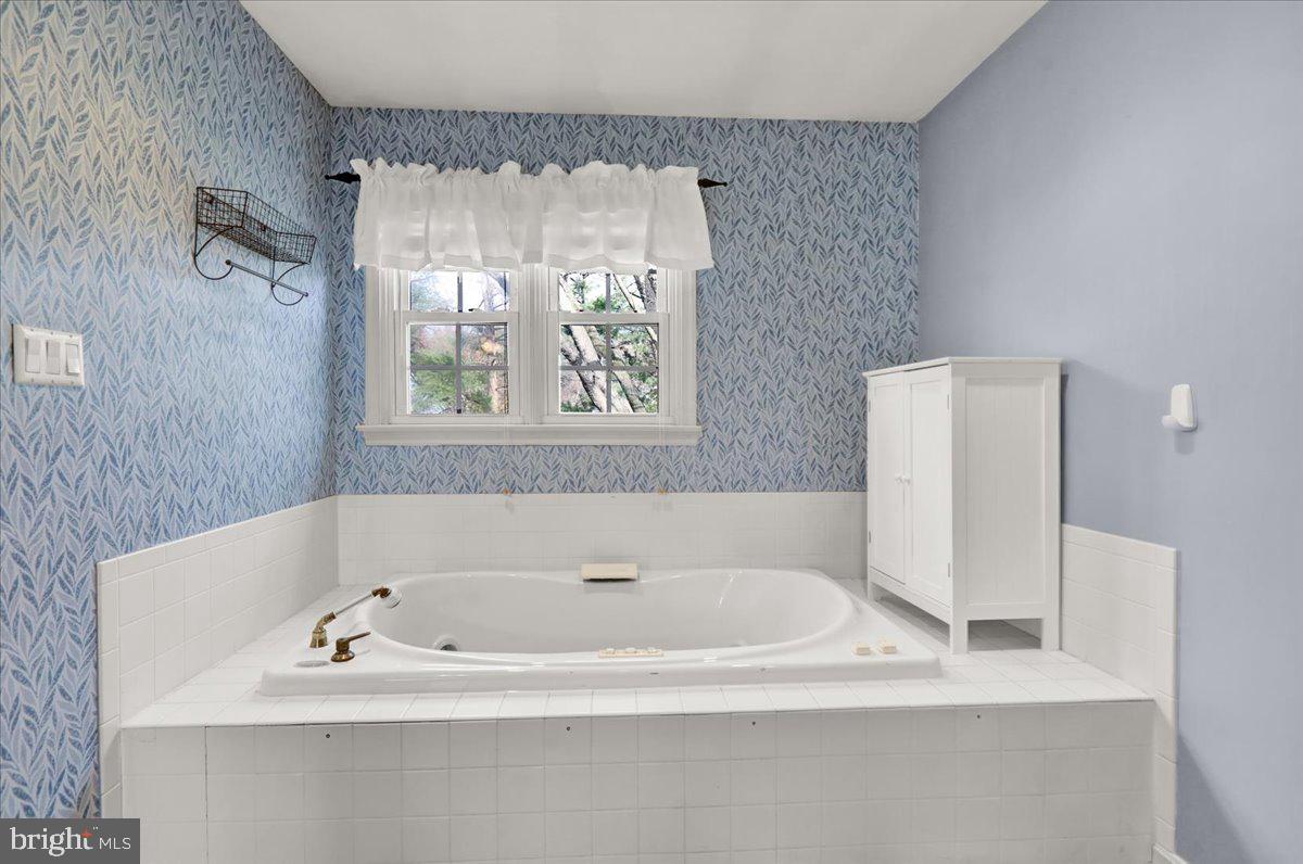 561 Millcross Road Lancaster, PA 17601 - Photo 25 of 52 a white bath tub sitting in a bathroom