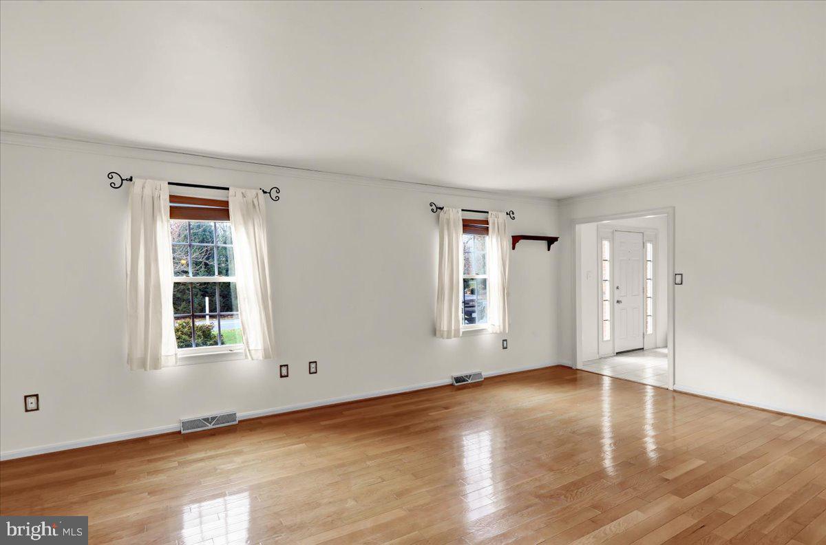 561 Millcross Road Lancaster, PA 17601 - Photo 4 of 52 an empty room with wooden floor and windows