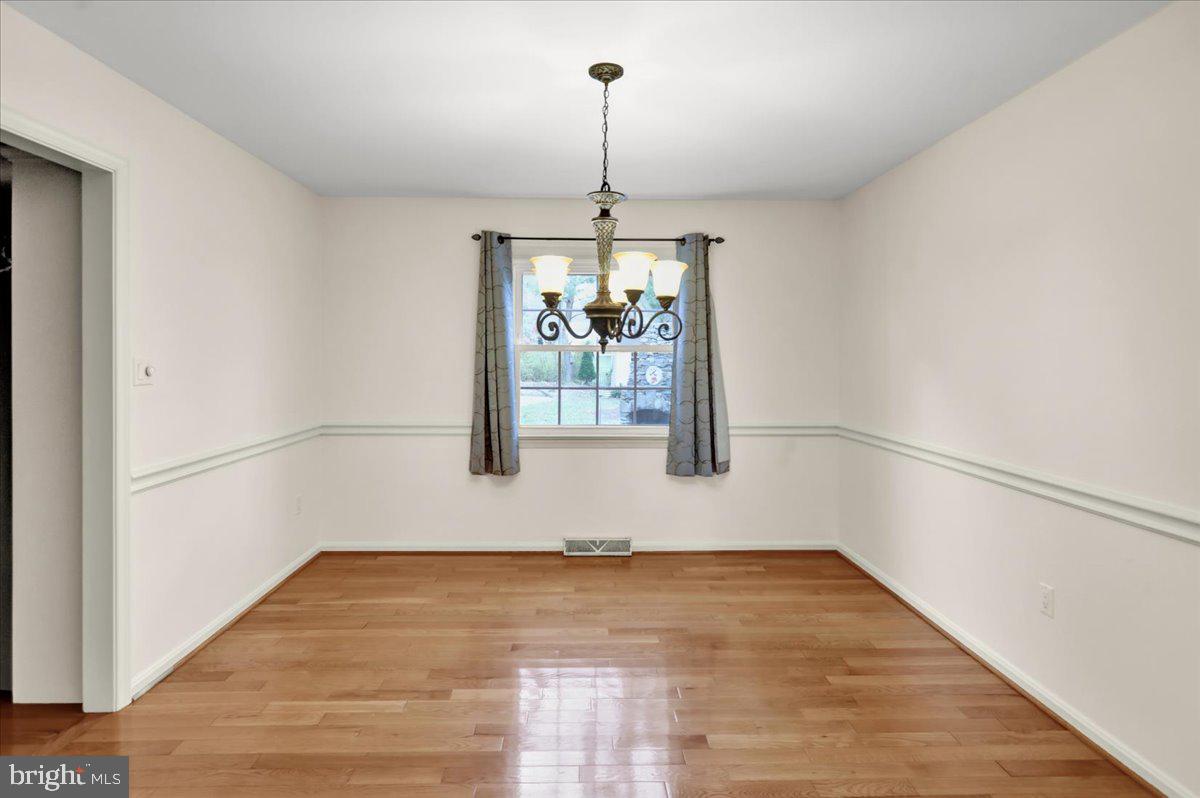 561 Millcross Road Lancaster, PA 17601 - Photo 7 of 52 a view of a room with wooden floor ceiling fan and window