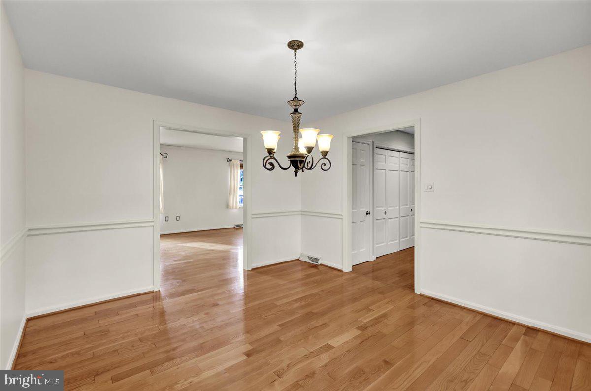561 Millcross Road Lancaster, PA 17601 - Photo 8 of 52 a view of a room with wooden floor ceiling fan and refrigerator