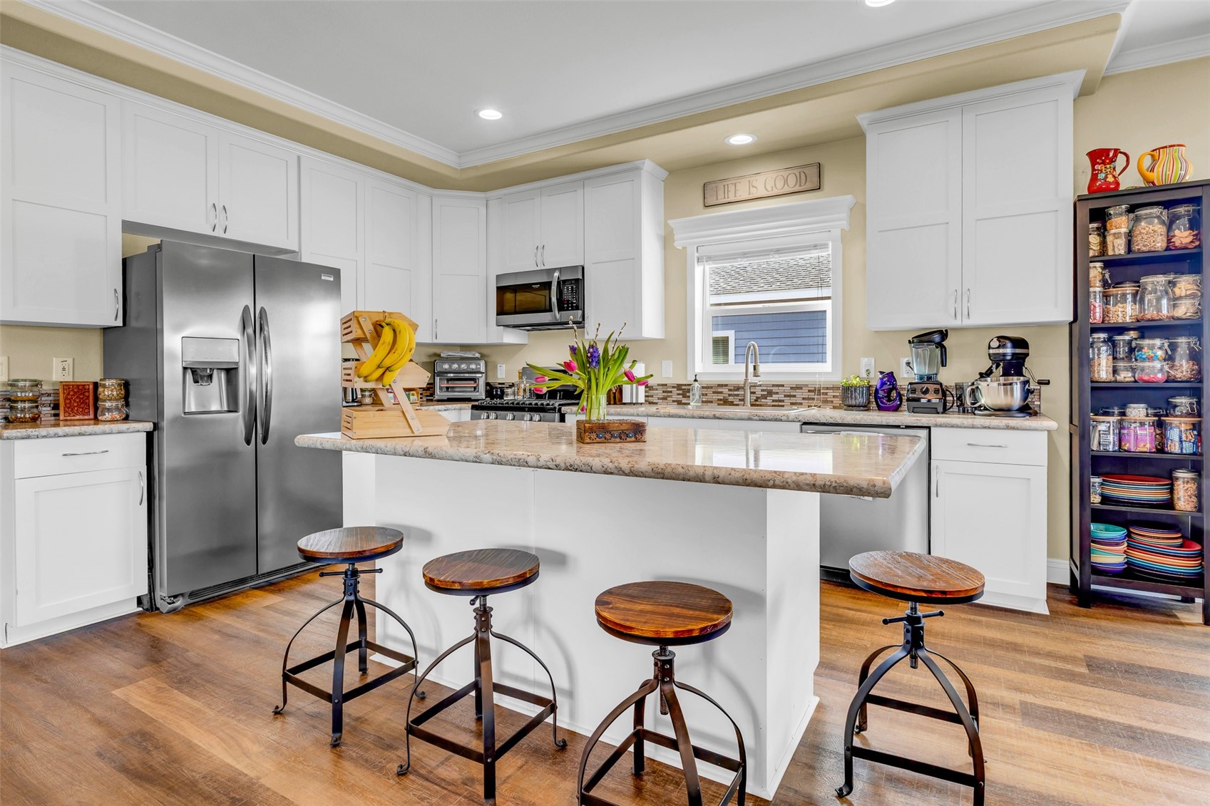 108 A Sun Rock Road, Unit A Fairplay, CO 80440 - Photo 3 of 48 a kitchen with stainless steel appliances a dining table chairs refrigerator and sink