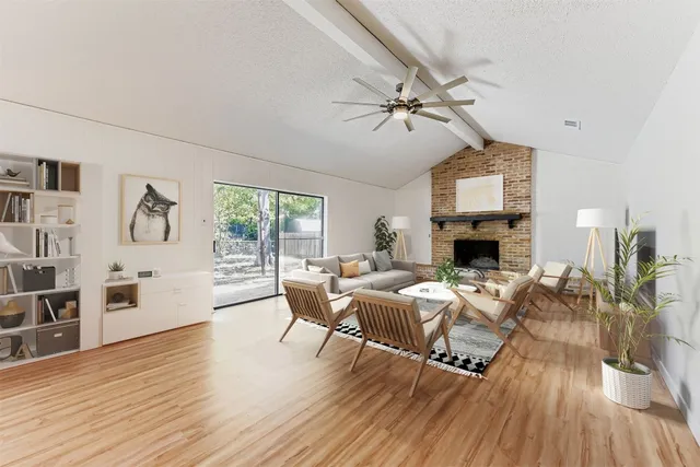 a living room with furniture or fireplace and a wooden floor