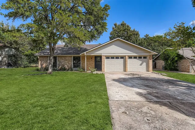 a front view of a house with yard