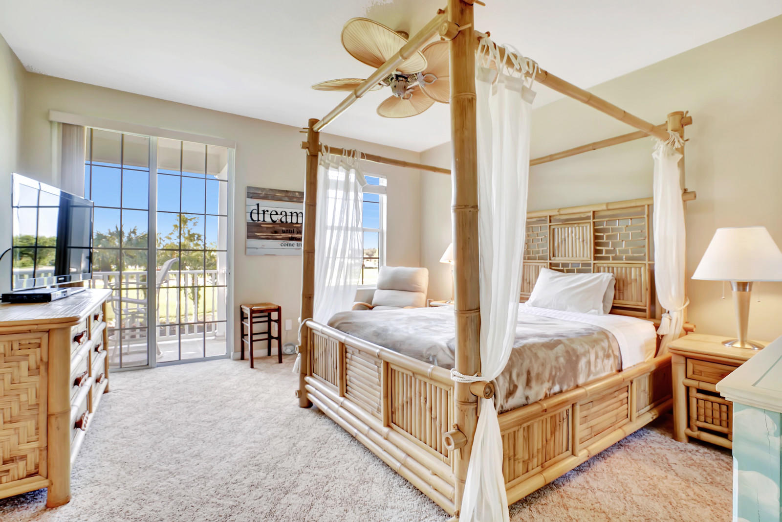 144 Radcliffe Court Jupiter, FL 33458 - Photo 10 of 28 a bedroom with bed and wooden floor