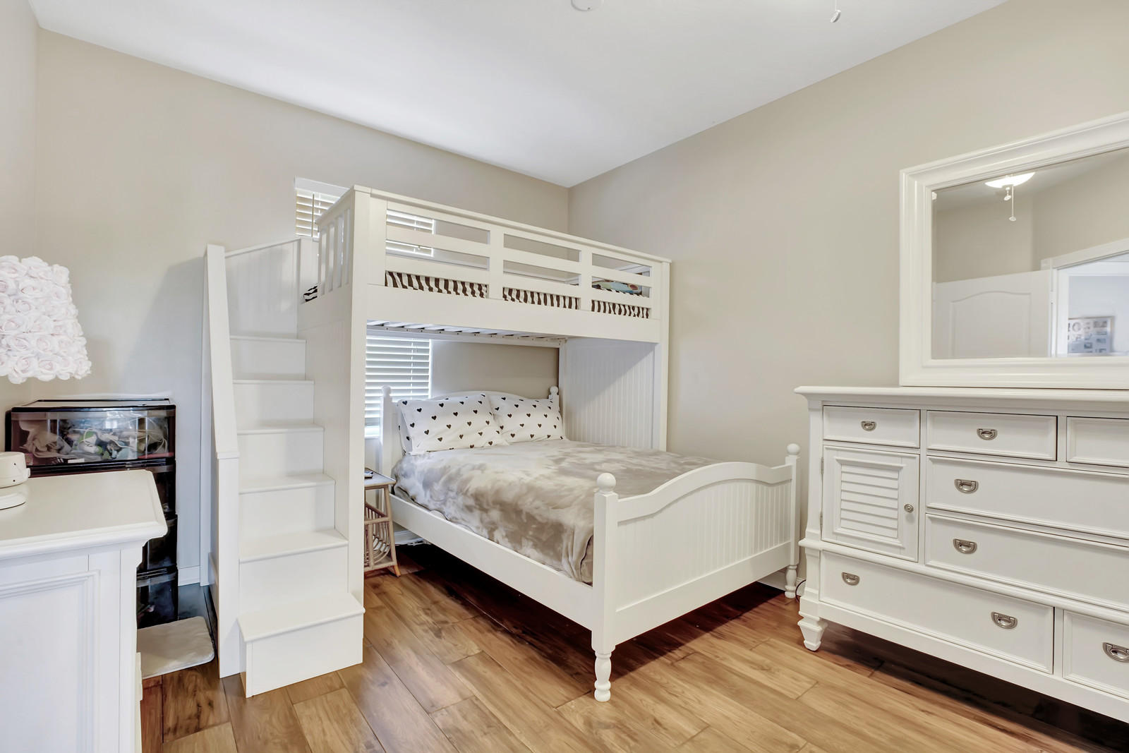 144 Radcliffe Court Jupiter, FL 33458 - Photo 12 of 28 a bedroom with a bed and a mirror