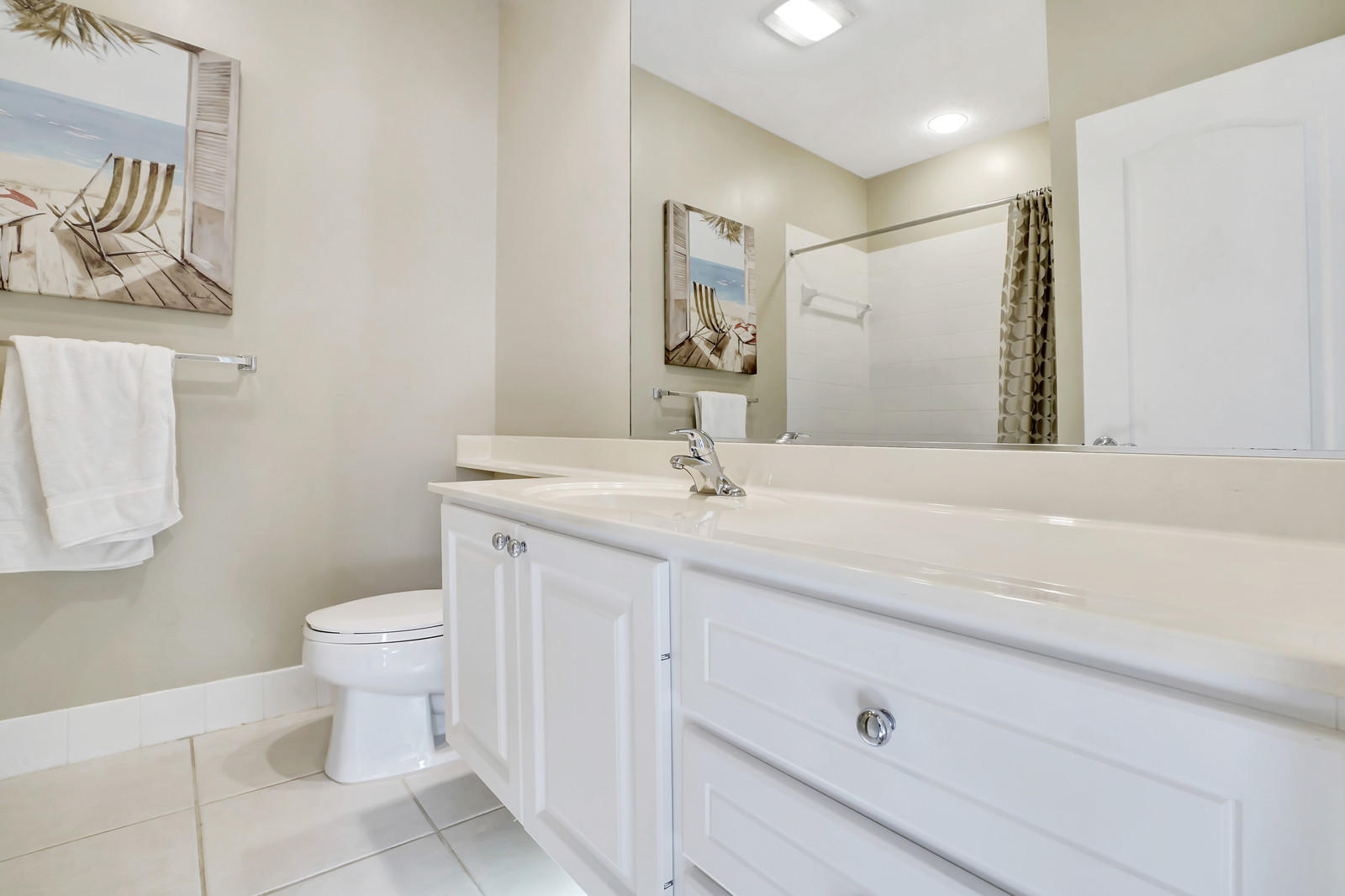 144 Radcliffe Court Jupiter, FL 33458 - Photo 14 of 28 a bathroom with a toilet sink and mirror