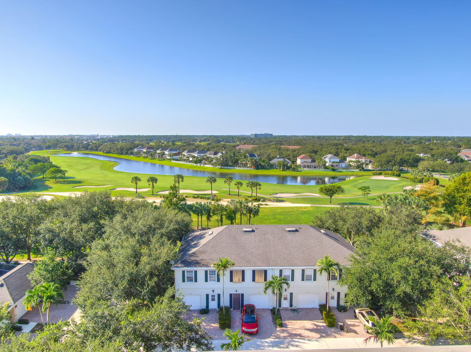 144 Radcliffe Court Jupiter, FL 33458 - Photo 3 of 28 an aerial view of a house with a garden