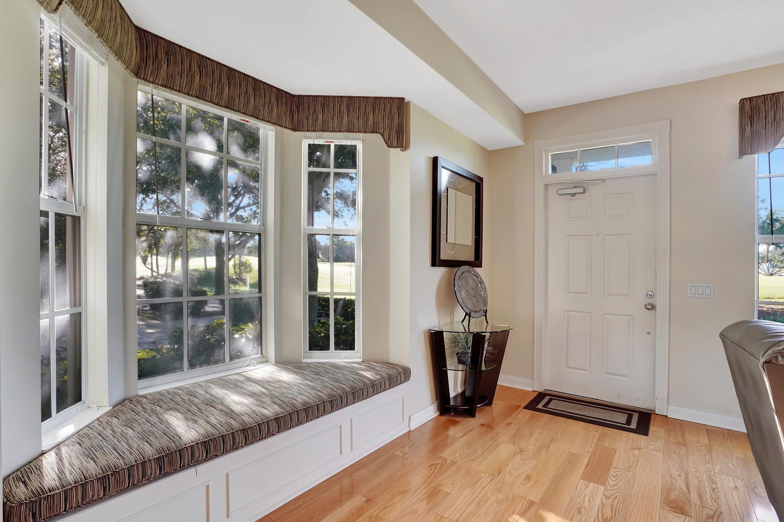 144 Radcliffe Court Jupiter, FL 33458 - Photo 6 of 28 a bed sitting in a spacious bedroom next to a window