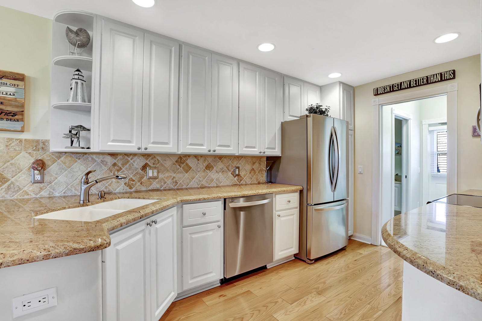 144 Radcliffe Court Jupiter, FL 33458 - Photo 8 of 28 a kitchen with stainless steel appliances granite countertop a refrigerator and a sink
