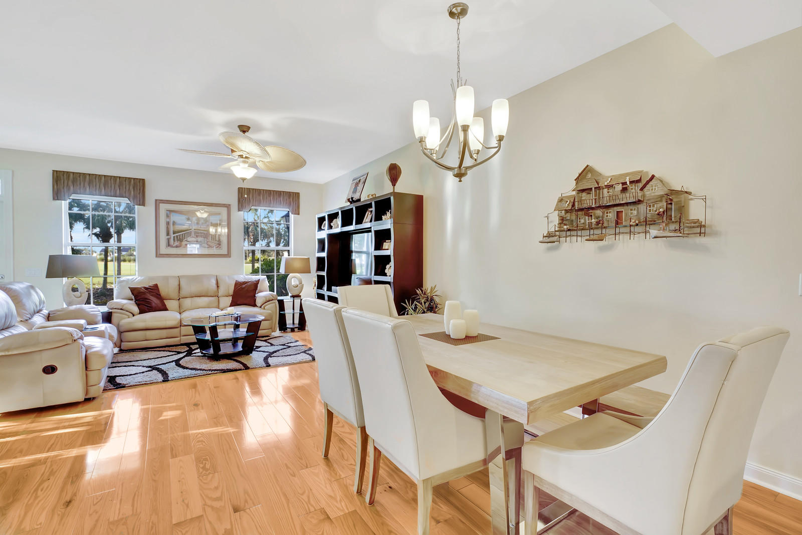 144 Radcliffe Court Jupiter, FL 33458 - Photo 27 of 28 a view of a dining room with furniture a chandelier and a chandelier