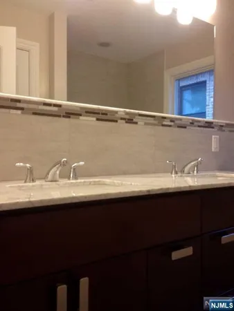 a close view of sink and mirror