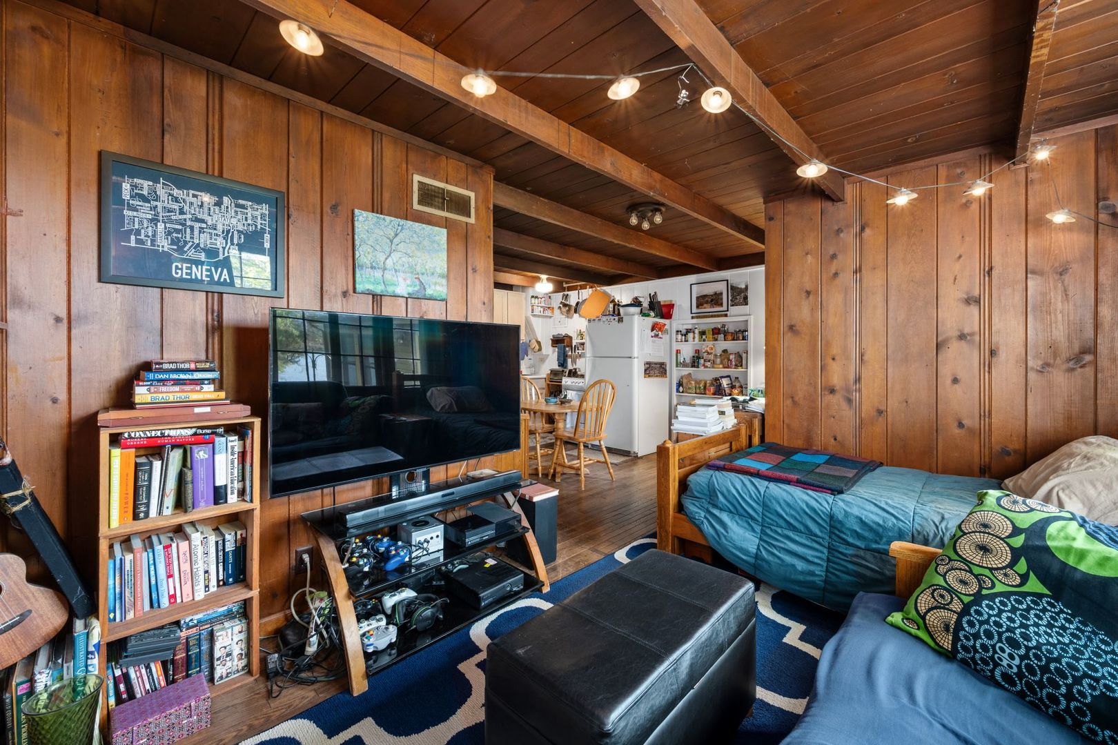 202 North Bennett Street Geneva, IL 60134 - Photo 24 of 40 a living room with furniture a flat screen tv and a bookshelf