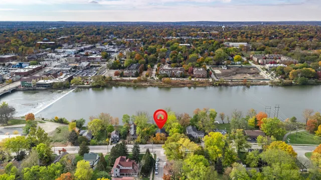 an aerial view of residential house with outdoor space and lake view