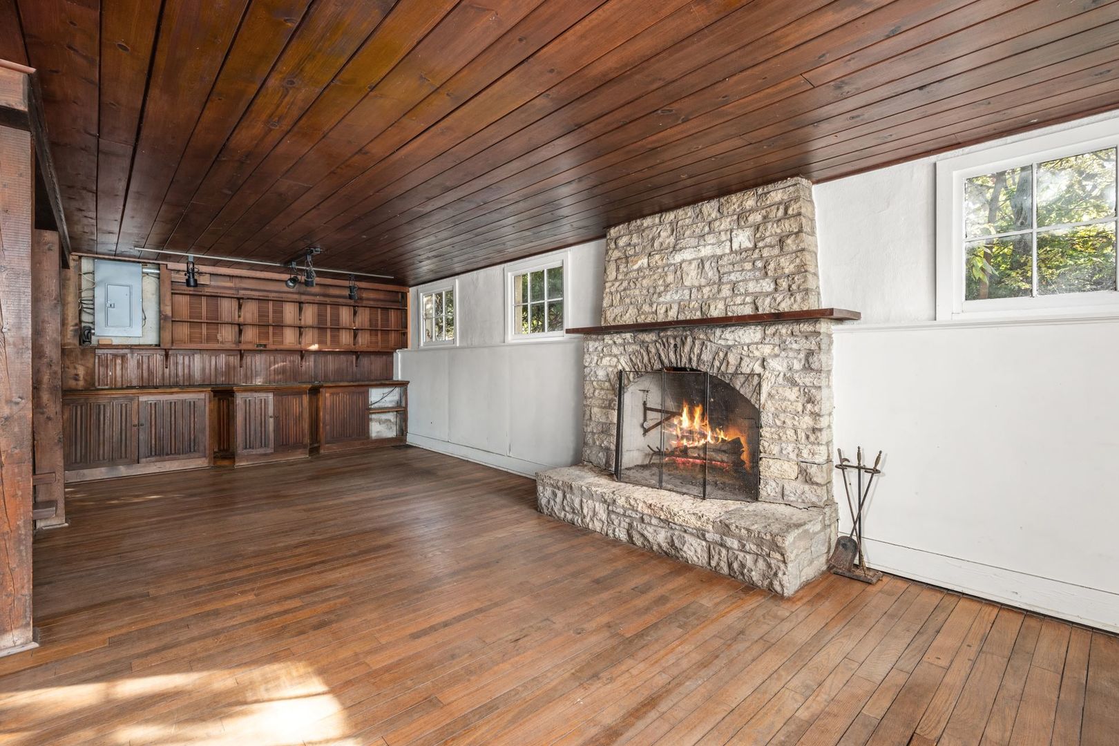 202 North Bennett Street Geneva, IL 60134 - Photo 6 of 40 a view of a livingroom with wooden floor and a fireplace
