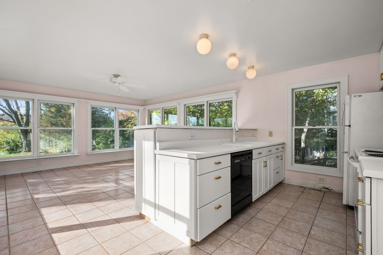 202 North Bennett Street Geneva, IL 60134 - Photo 8 of 40 a kitchen with a stove a sink and a refrigerator