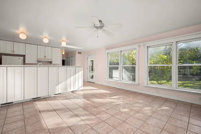 a view of a kitchen with a sink and cabinets