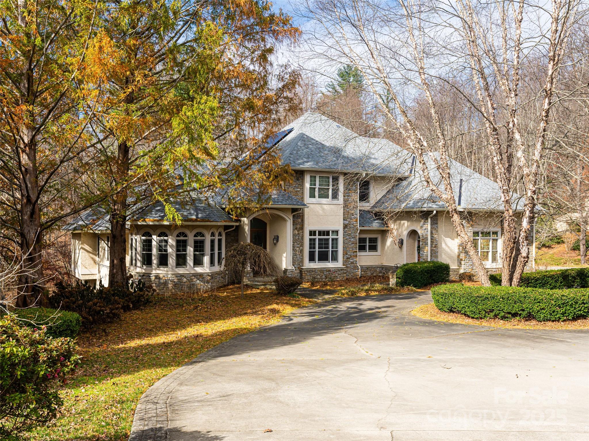 10 Walnut Lane Fletcher, NC 28732 - Photo 1 of 48 a front view of a house with a yard