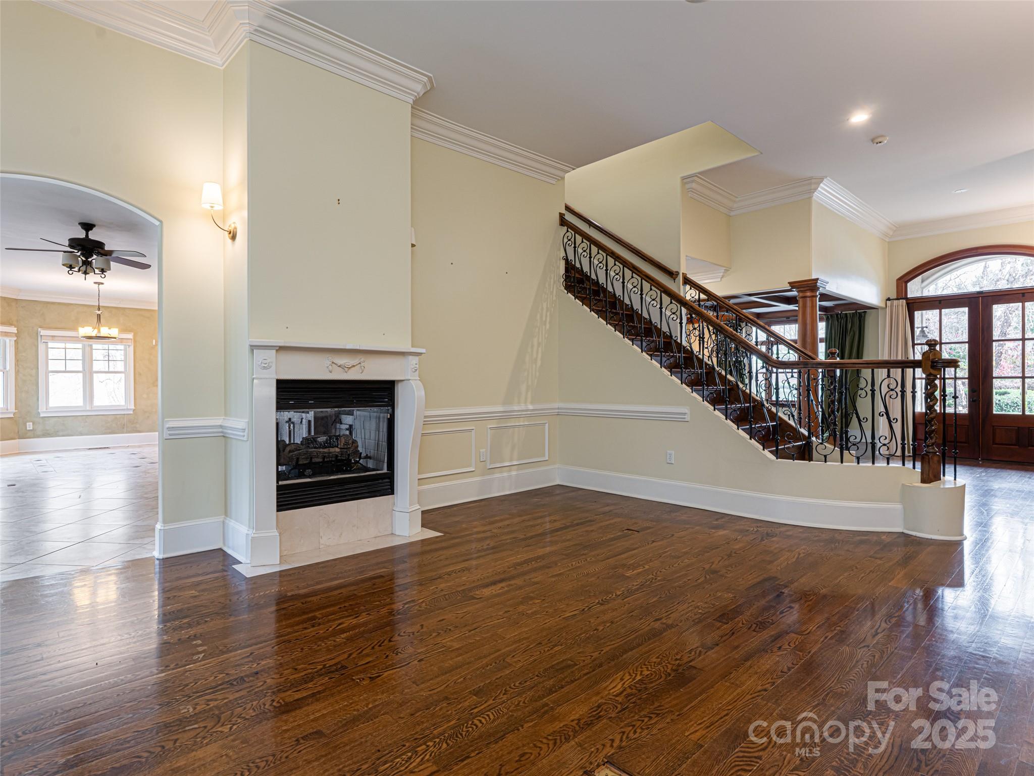 10 Walnut Lane Fletcher, NC 28732 - Photo 13 of 48 a view of a livingroom with wooden floor a fireplace and entryway