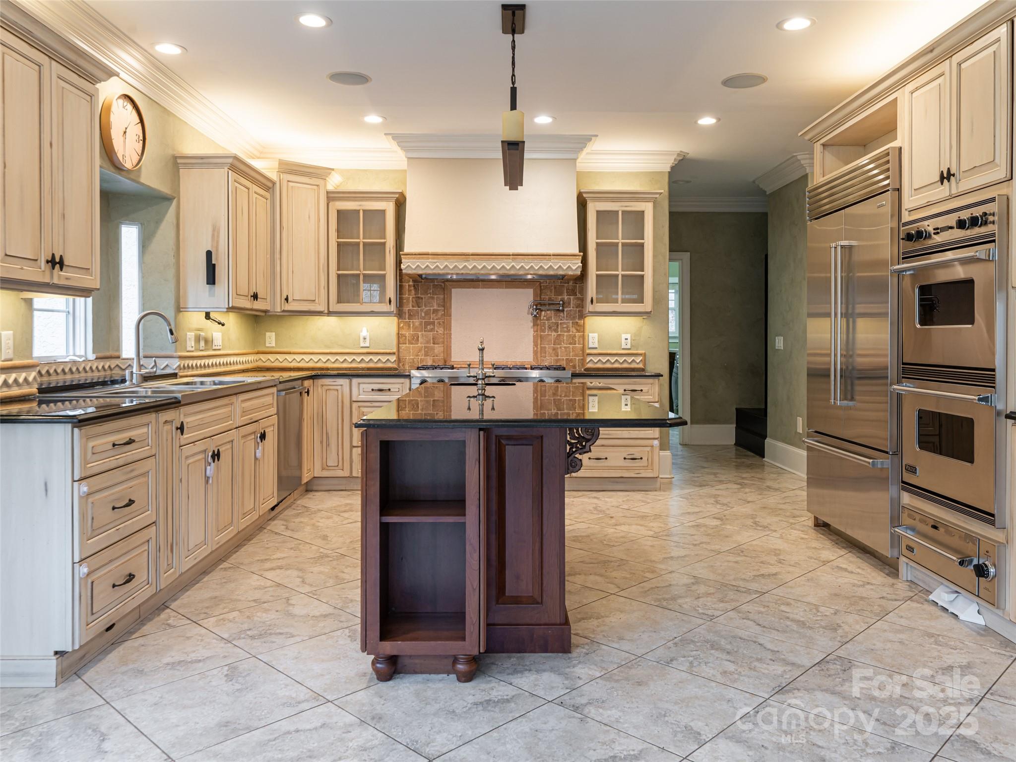 10 Walnut Lane Fletcher, NC 28732 - Photo 16 of 48 a kitchen with stainless steel appliances granite countertop a stove sink and cabinets
