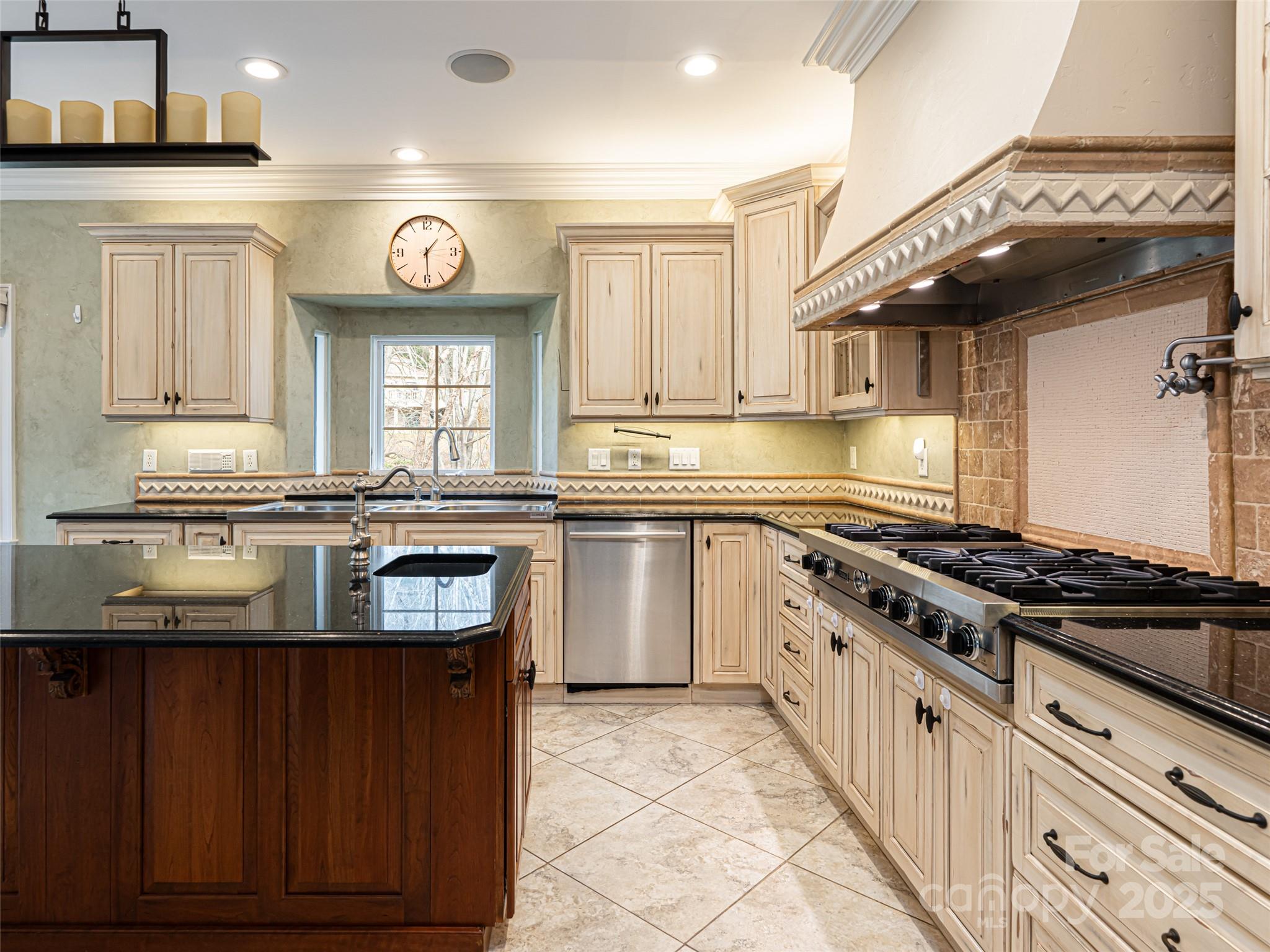 10 Walnut Lane Fletcher, NC 28732 - Photo 18 of 48 a kitchen with stainless steel appliances granite countertop a stove a sink and a microwave