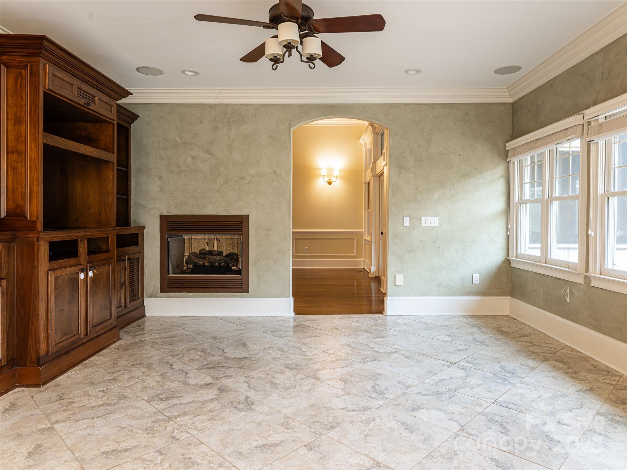10 Walnut Lane Fletcher, NC 28732 - Photo 20 of 48 wooden floor fireplace and windows in a room