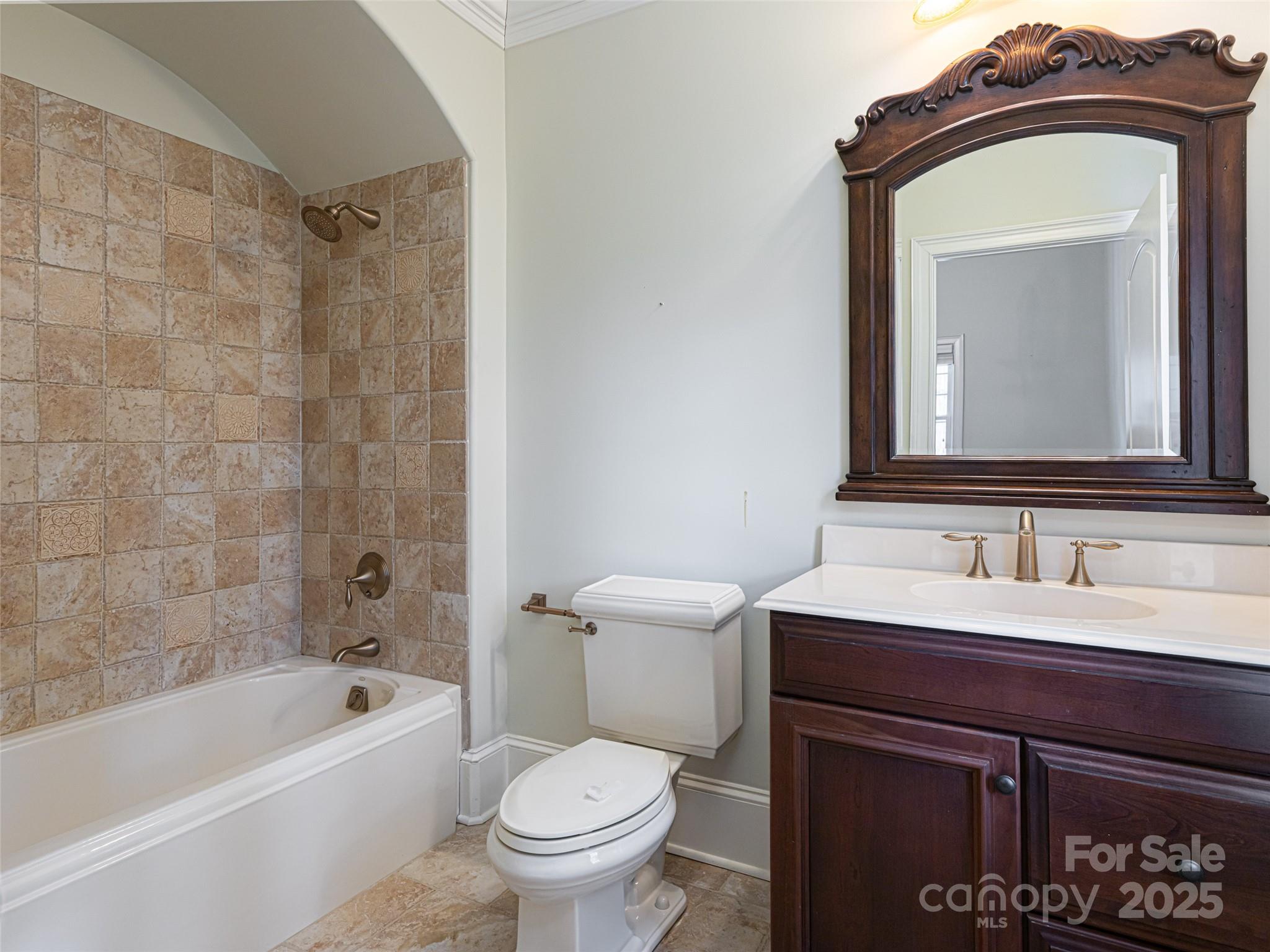 10 Walnut Lane Fletcher, NC 28732 - Photo 35 of 48 a bathroom with a toilet sink and mirror