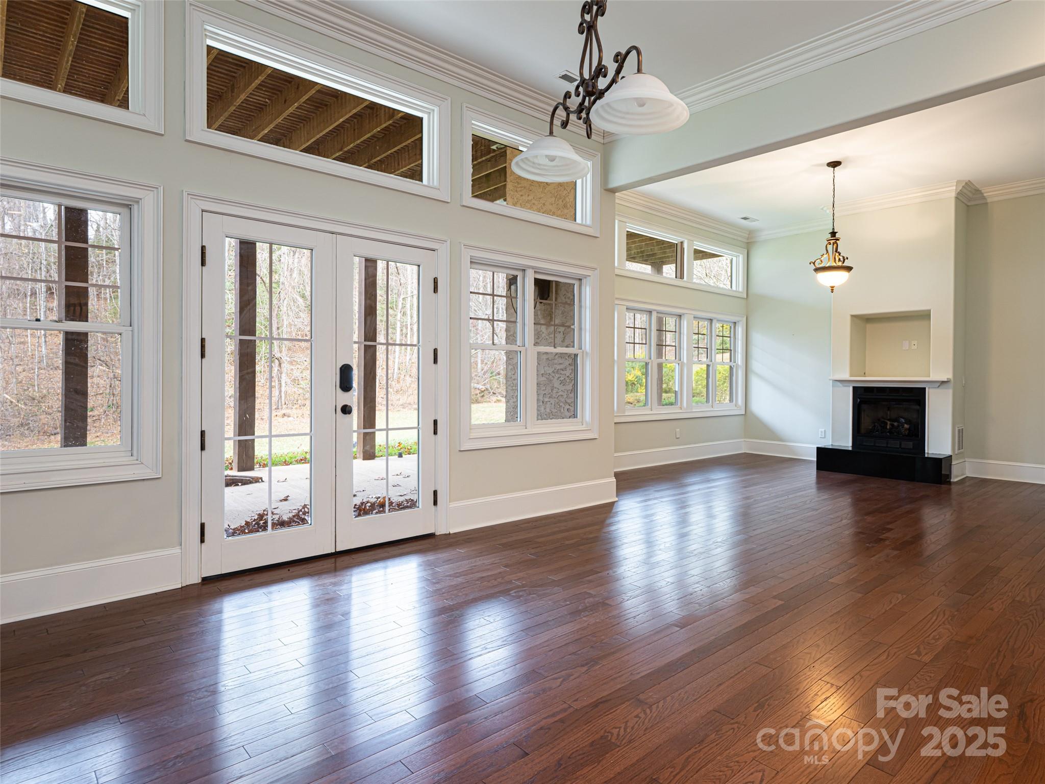 10 Walnut Lane Fletcher, NC 28732 - Photo 37 of 48 a view of an empty room with wooden floor and a window