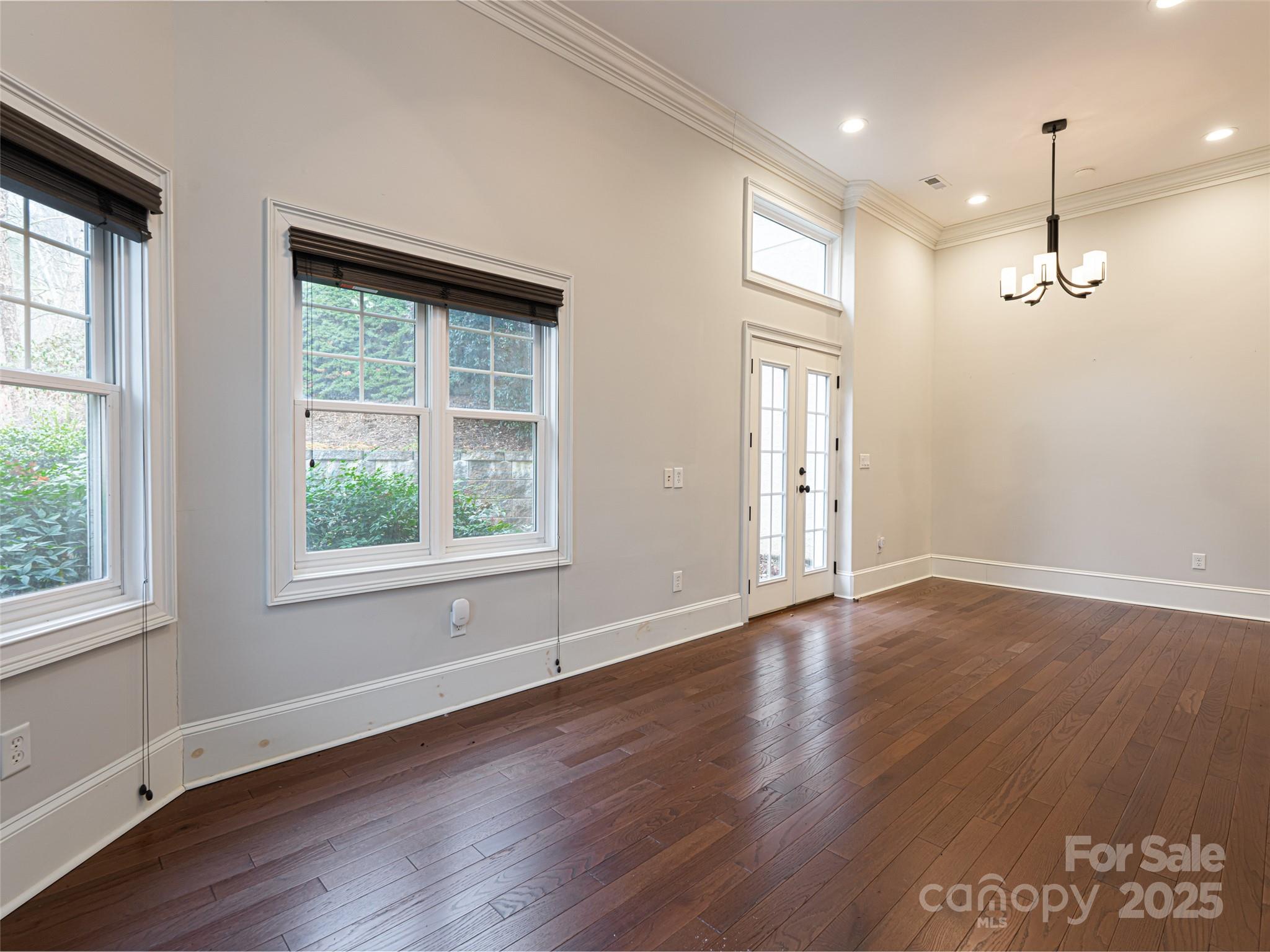 10 Walnut Lane Fletcher, NC 28732 - Photo 39 of 48 an empty room with wooden floor and windows