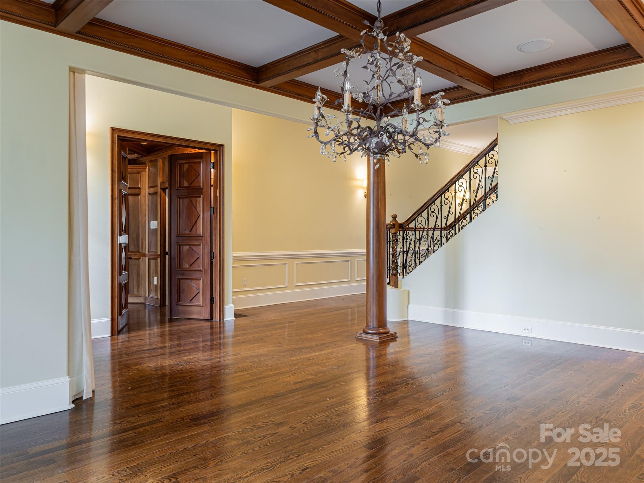 10 Walnut Lane Fletcher, NC 28732 - Photo 6 of 48 a view of a hallway with wooden floor and a chandelier