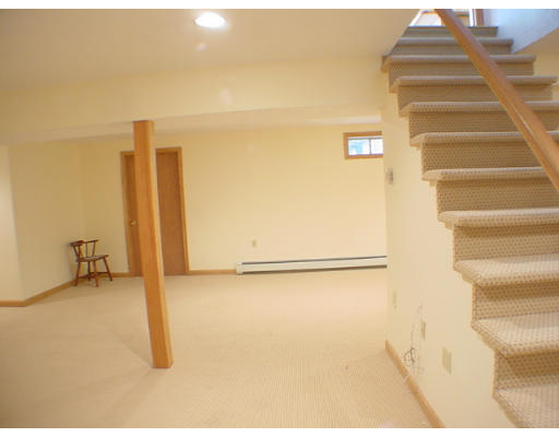 26 Stoneybrook Road Grafton, MA 01536 - Photo 21 of 28 a view of an empty room with stairs