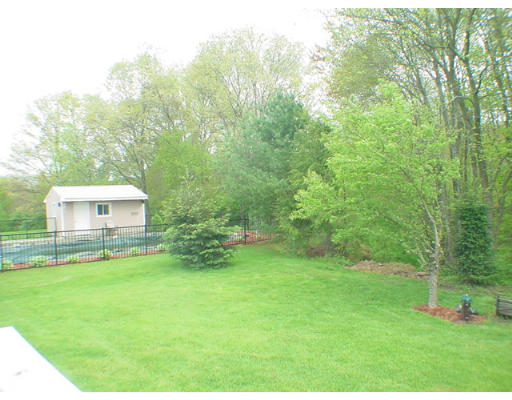 26 Stoneybrook Road Grafton, MA 01536 - Photo 26 of 28 a view of a house with a backyard