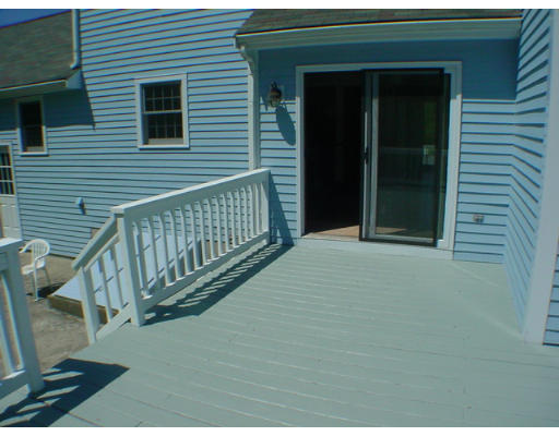 26 Stoneybrook Road Grafton, MA 01536 - Photo 27 of 28 a view of a house with porch and wooden floor