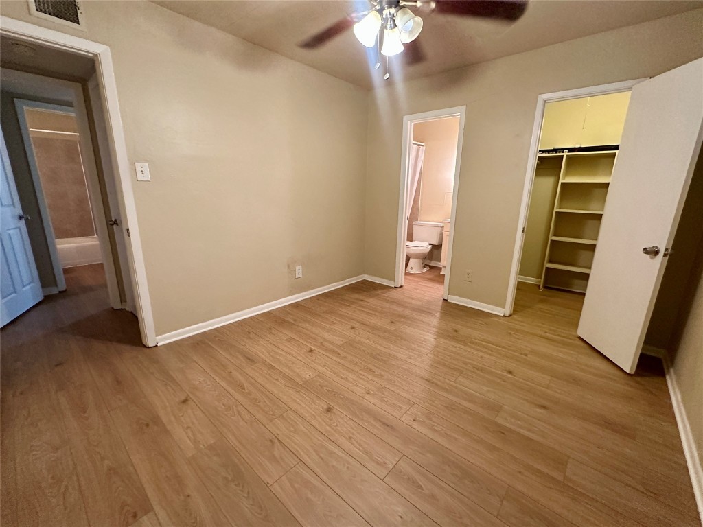 803 West 28th Street, Unit 106 Austin, TX 78705 - Photo 11 of 20 an empty room with wooden floor and closet
