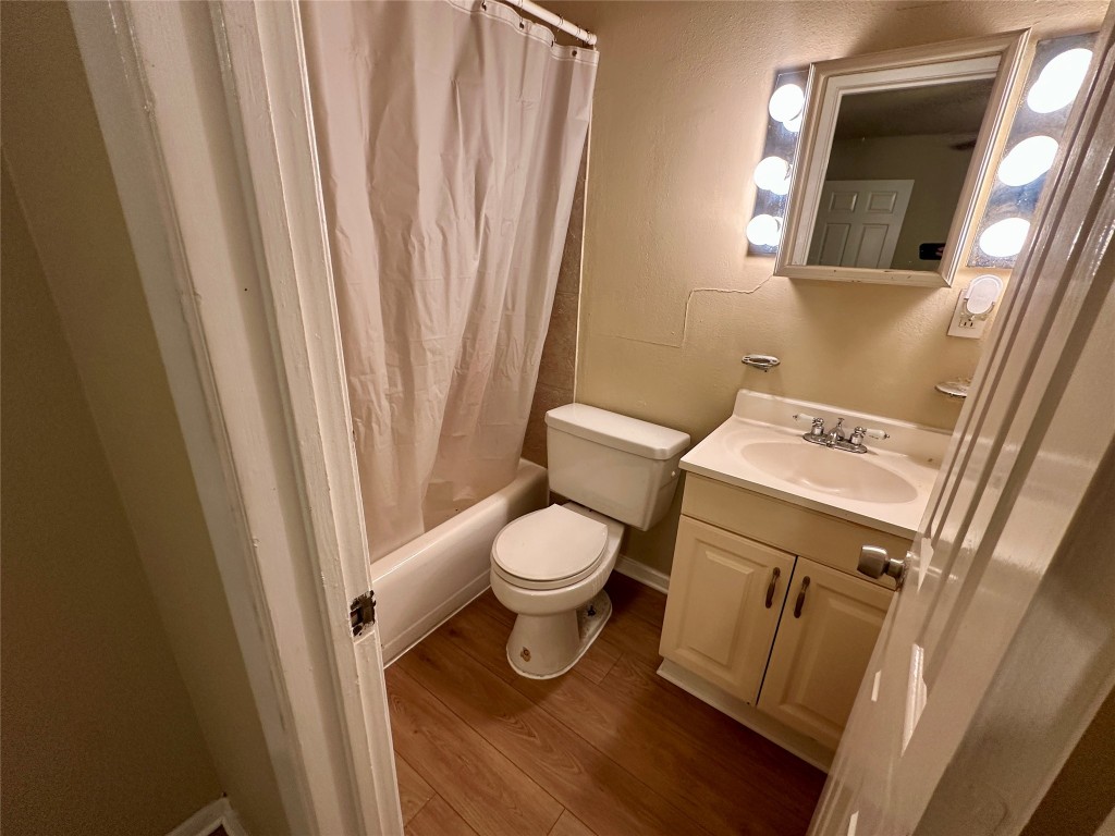 803 West 28th Street, Unit 106 Austin, TX 78705 - Photo 13 of 20 a white toilet sitting next to a sink